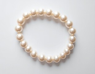 Obraz premium Classic white pearl bracelet with a gold clasp, timeless piece of jewelry for every occasion