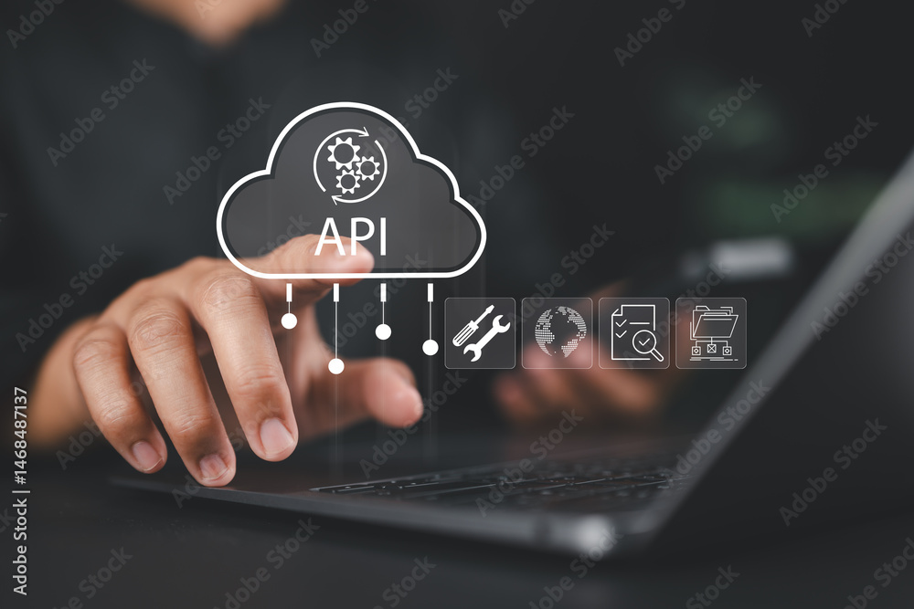 Fototapete Cloud API, application programming interface concept. Software development tool, cloud computing technology. Businessman touch API icon on virtual screen.