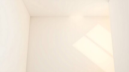 Fototapeta premium Sunlight streams into a stark white room corner, casting a sharp geometric shadow and highlighting the clean, minimalist lines and empty space of the interior.