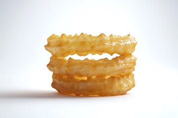 cookies on a golden fried onion rings stacked on top of each other, set against a clean white background