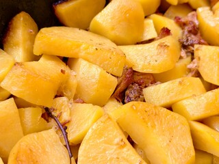 Savory stewed potatoes with tender meat simmered to perfection in a rustic kitchen setting during a cozy family gathering