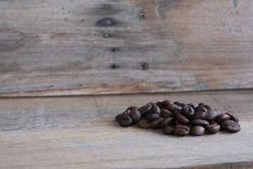 Coffee beans on a wooden background