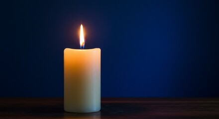 Single candle flame, warm light