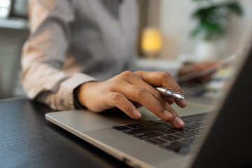 Fototapeta premium businessman is checking financial documents to match the information summarized by the accounting department, accountant, marketing department, working in the office with paperwork