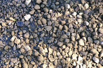 Abstract image of gravel stones on a road construction