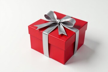 Obraz premium A vibrant red gift box adorned with a sophisticated silver ribbon, a perfect symbol of thoughtful celebration and festive cheer