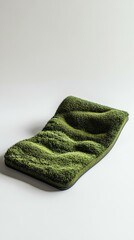 Fototapeta premium Green textured mat resembling grass landscape.