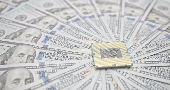 A microchip atop a cascade of U.S. dollar bills depicts the intersection of technological innovation and economic power, reflecting the critical role of semiconductors in global trade and geopolitics.