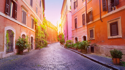 Obraz premium Colorful Cobblestone Street in a European Town at Sunset