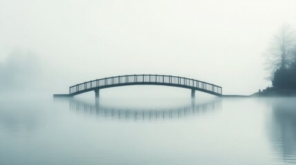 Tranquil wooden bridge over a misty lake
