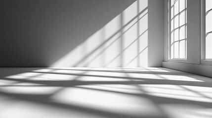 Fototapeta premium Empty room illuminated by sunlight casting shadows.