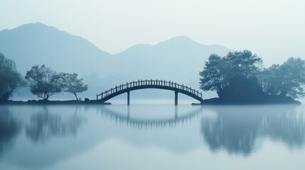 Misty lake landscape with arched bridge