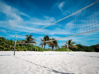 Beach Volleyball Net on Sunny Sandy Beach
