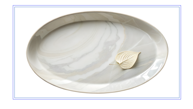 Elegant marble serving platter with a decorative leaf against a vivid blue background