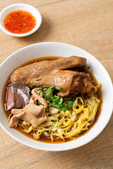 egg noodles with stewed and braised duck in brown soup