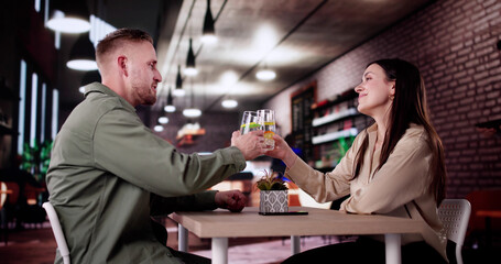 Couple Enjoying Wine And Dining