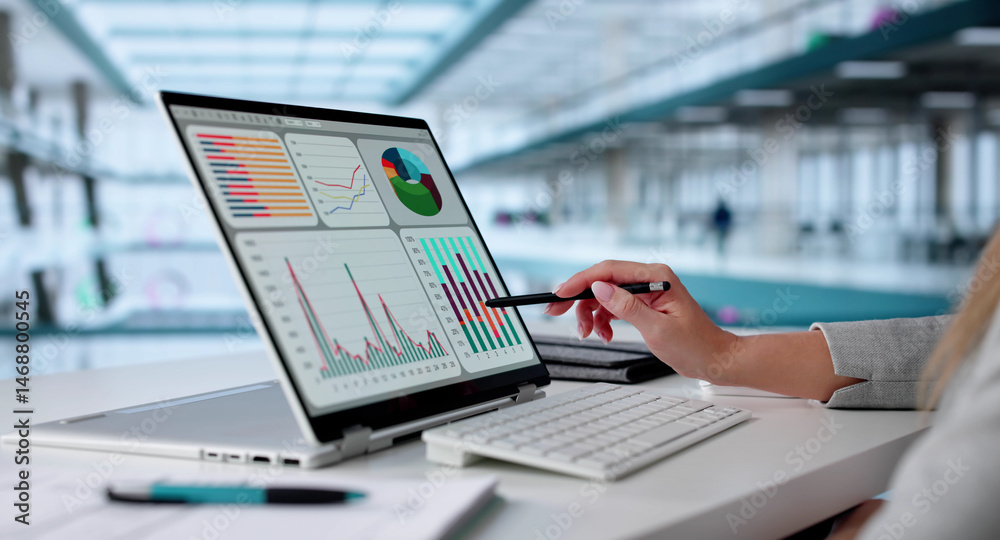 Poster female data analyst analyzing kpi dashboard on laptop