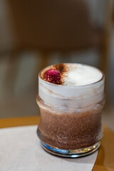 Chocolate and cinnamon ice drink with milk cream. Chocolate drink sensation with cinnamon.