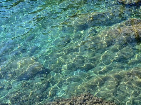Sea beautiful tranquil clear water surface.