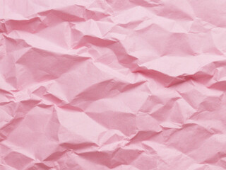 Fototapeta premium Crumpled pink paper texture. Pink wallpaper background 