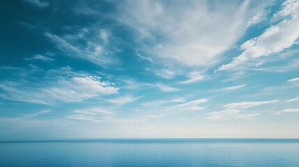 Obraz premium Calm Sea with Blue Sky, and Cloudscape.