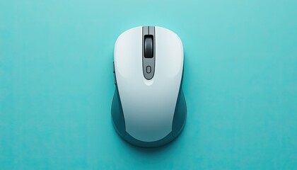 A top down view of a white and gray computer mouse on a light blue background in a studio setting