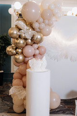 White cake for celebrating a child's baptism. Sweet cake with white wings. Photo zone for a child's...