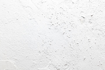 A white wall with a lot of dirt and dust on it