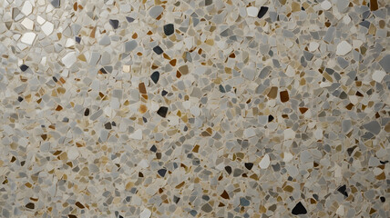 Polished terrazzo flooring with uniform light gray base, small white and beige stone chips evenly distributed, 