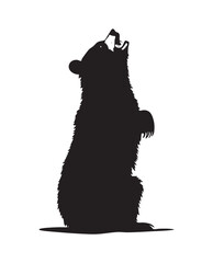 Silhouette of a bear standing on hind legs growling.