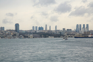 Naklejka premium Spring, Istanbul view from the sea. high-rise buildings, modern glass city and historic buildings. cityscape of Istanbul, Turkey, a popular tourist destination. Panoramic view of the city