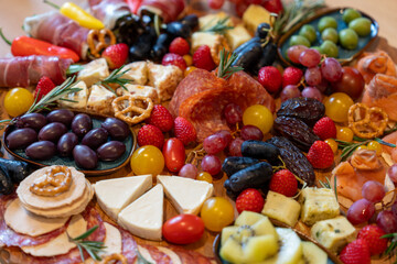 Charcuterie Board with Meats, Cheeses, Fruits, and Nuts