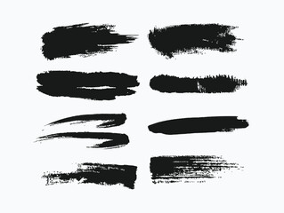 Black brush strokes on white paper create an artistic background