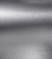Sleek silver, subtly scratched, polished gleam ,  surface,  minimal,  material