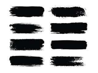 Black ink brush strokes and splatters on a white background.