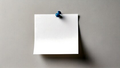 Blank white note paper with a slightly textured surface, neatly pinned to a gray wall. target, reminder, goal.
