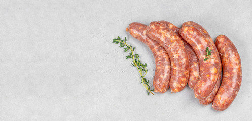 Raw meat sausages. Grilling food, bbq, barbecue. Long banner format. top view © Надія Коваль