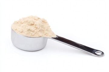 Scoop of protein powder in stainless steel measuring spoon
