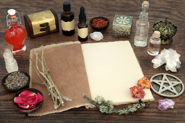 Herbs and magical equipment for alternative herbal medicine with book of spells. Witchcraft occult...
