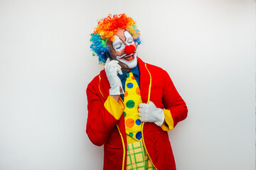Happy smiling clown with smartphone
