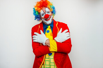 Clown with arms crossed and a friendly face