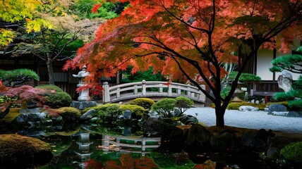 Obraz premium Breathtaking Japanese Garden in Autumn with Red Maple Tree Reflecting on Pond and Stone Bridge