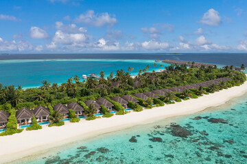 Aerial view of maldives island resort. Luxury beach villas, turquoise waters, white sand beaches, palm trees, luxurious tropical paradise perfect for honeymoon destination relaxation, adventure escape