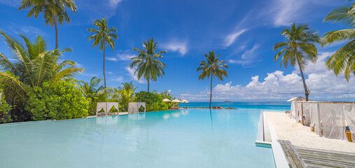 Stunning landscape infinity swimming pool sunny sky clouds. Tropical resort hotel in Maldives....
