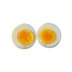 Sliced hard boiled eggs showing perfectly cooked yolks on a solid black background suitable for food photography and culinary concept applications