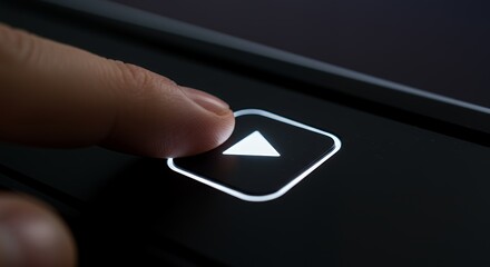 Finger Pressing Play Button on a Dark Device