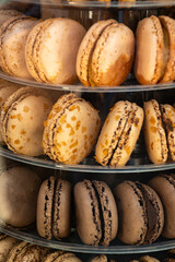 Macarons or French macaroon sweet meringue-based confection made with egg white, icing sugar, granulated sugar, almond meal, and food colouring, sweet french dessert on display