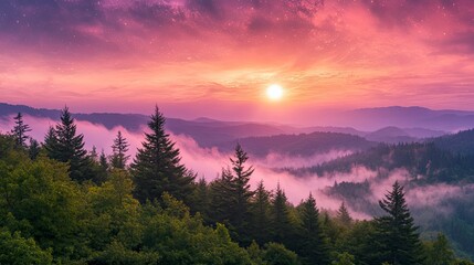 Stunning mountain landscape with a pink and orange sky as the sun sets behind the mountains