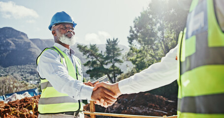 Construction worker, deal and handshake of engineer people outdoor for nature development. Mature...