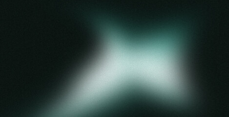 Fototapeta premium Abstract blurred teal and white shapes on dark background.